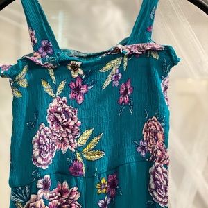 Teal flower print jumpsuit. Legs are capris, 7/8